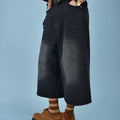 Men's loose straight fit denim shorts in blue, shown on a model for summer.