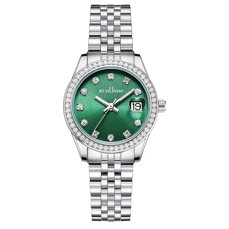 Women's silver alloy calendar watch with circular dial and stainless steel buckle on a wrist.