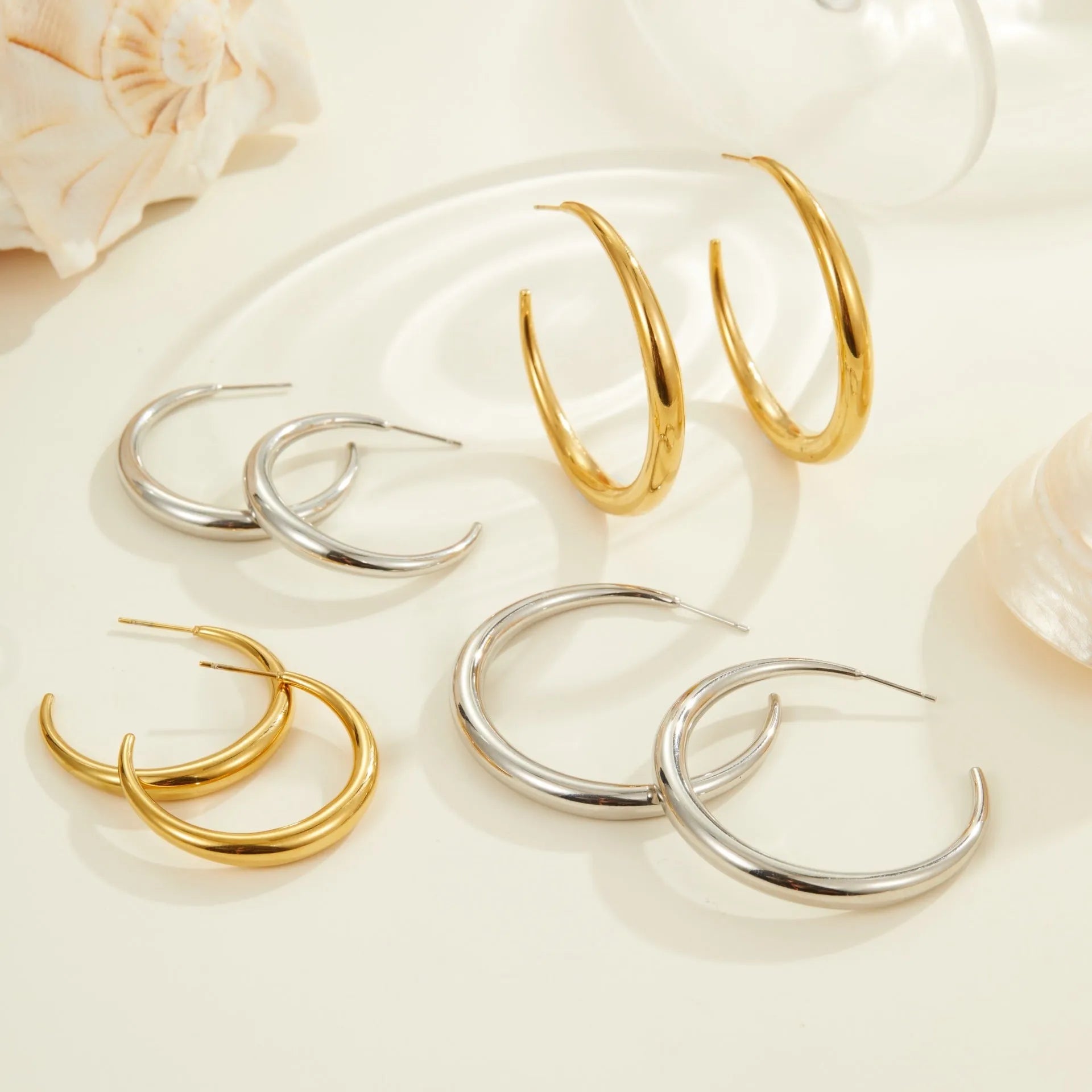 Titanium steel hoop earrings with geometric round design in gold and steel colour options