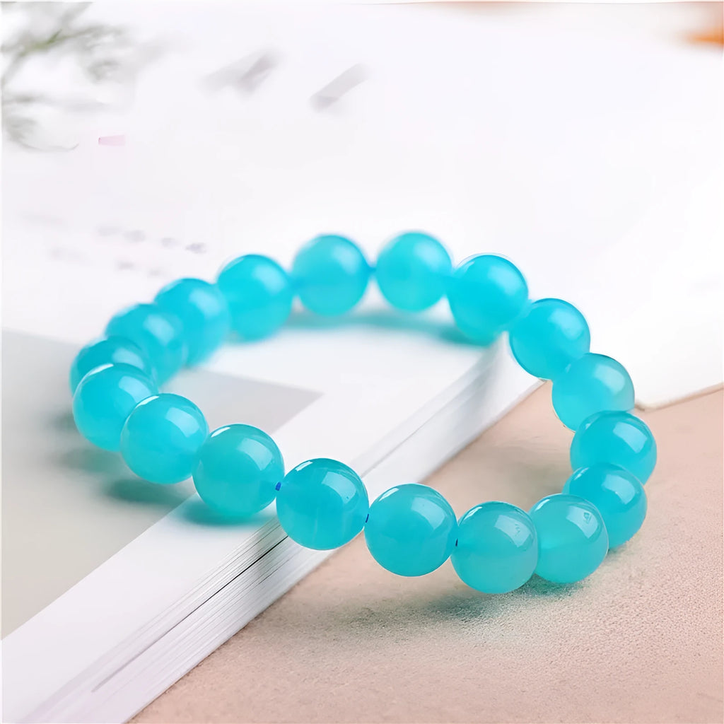Grade 7A Amazonite natural stone bracelet with polished ice-colour beads on a black elastic cord.
