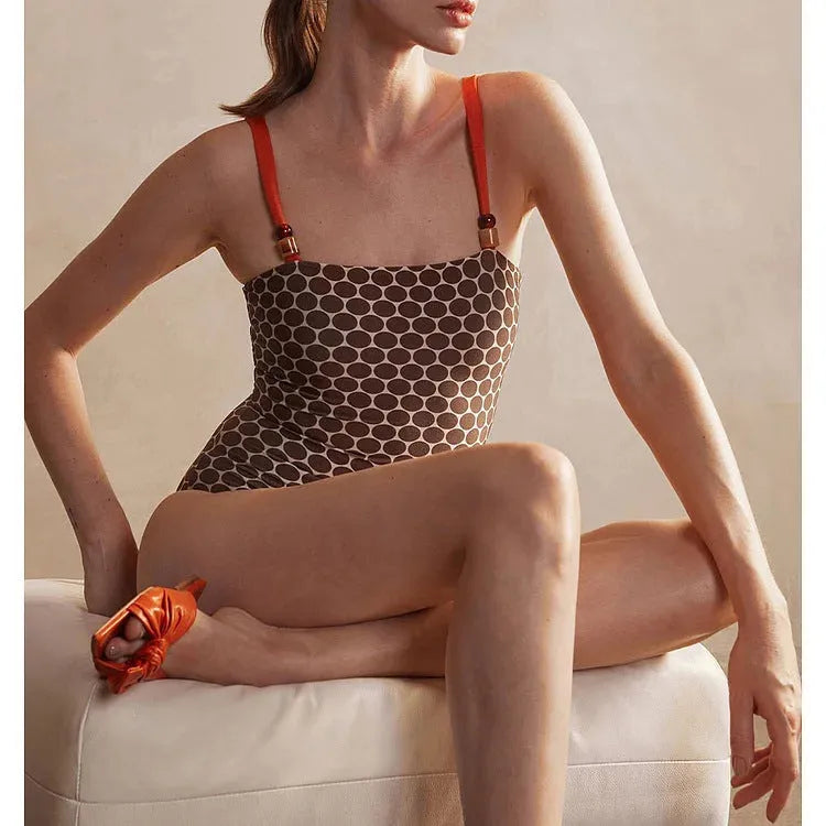 Women's printed one-piece swimsuit with dots pattern and matching wrap skirt