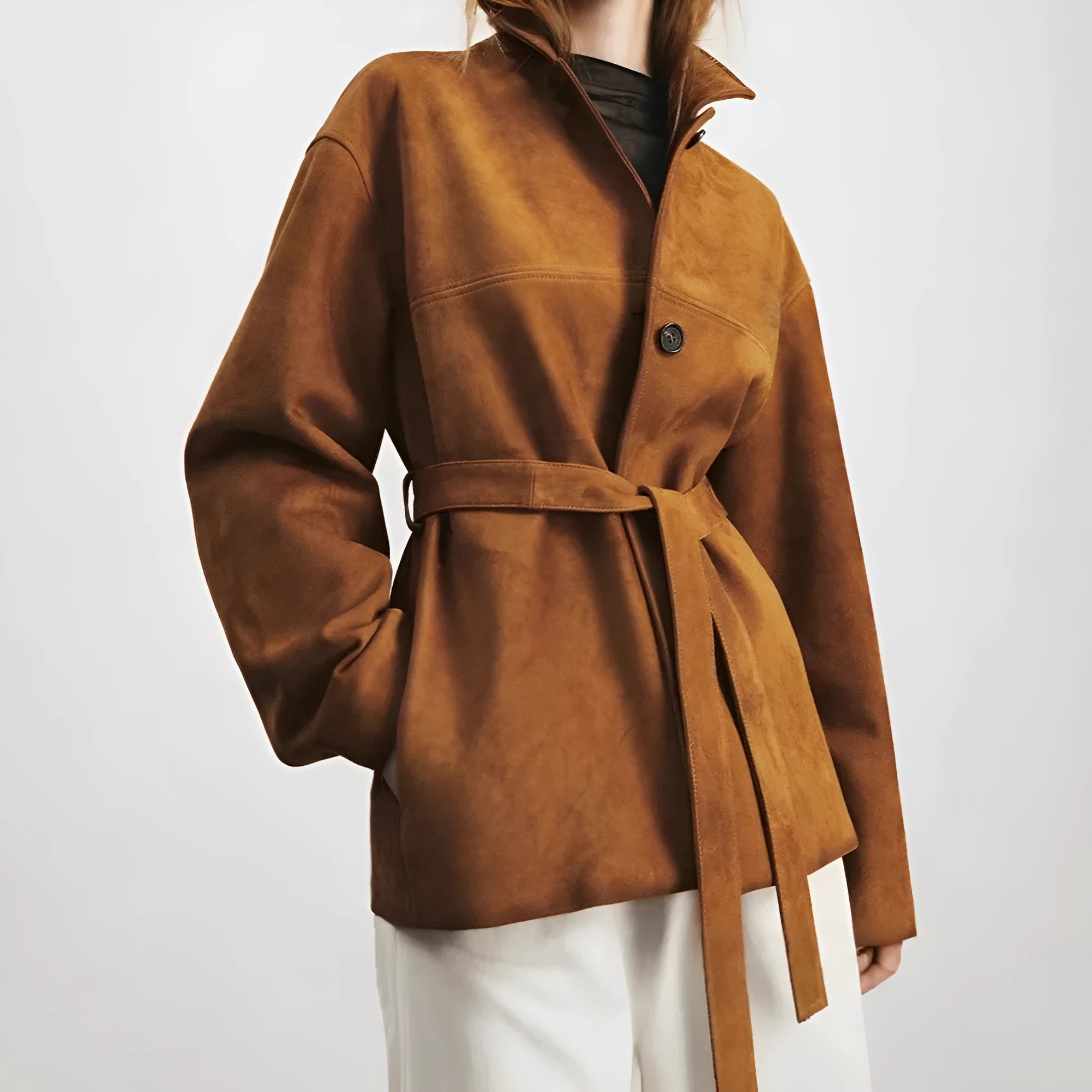 Yellow brown retro-style women's cashmere coat with a Peter Pan collar, leather stitching, and a belt.