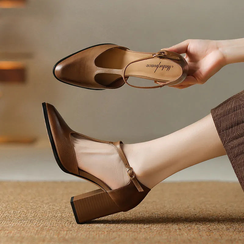 Women's retro pointed toe Mary Jane heels in dark brown with a buckle strap and hollow front design.
