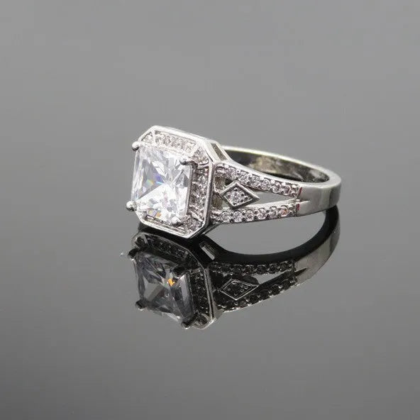 Women's geometric hollow zircon ring in platinum colour showing quadrilateral design and inlaid stones