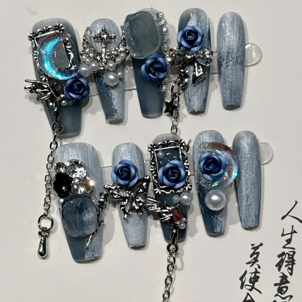 Blue evening manicure set with rose pattern on plastic nail armour suit