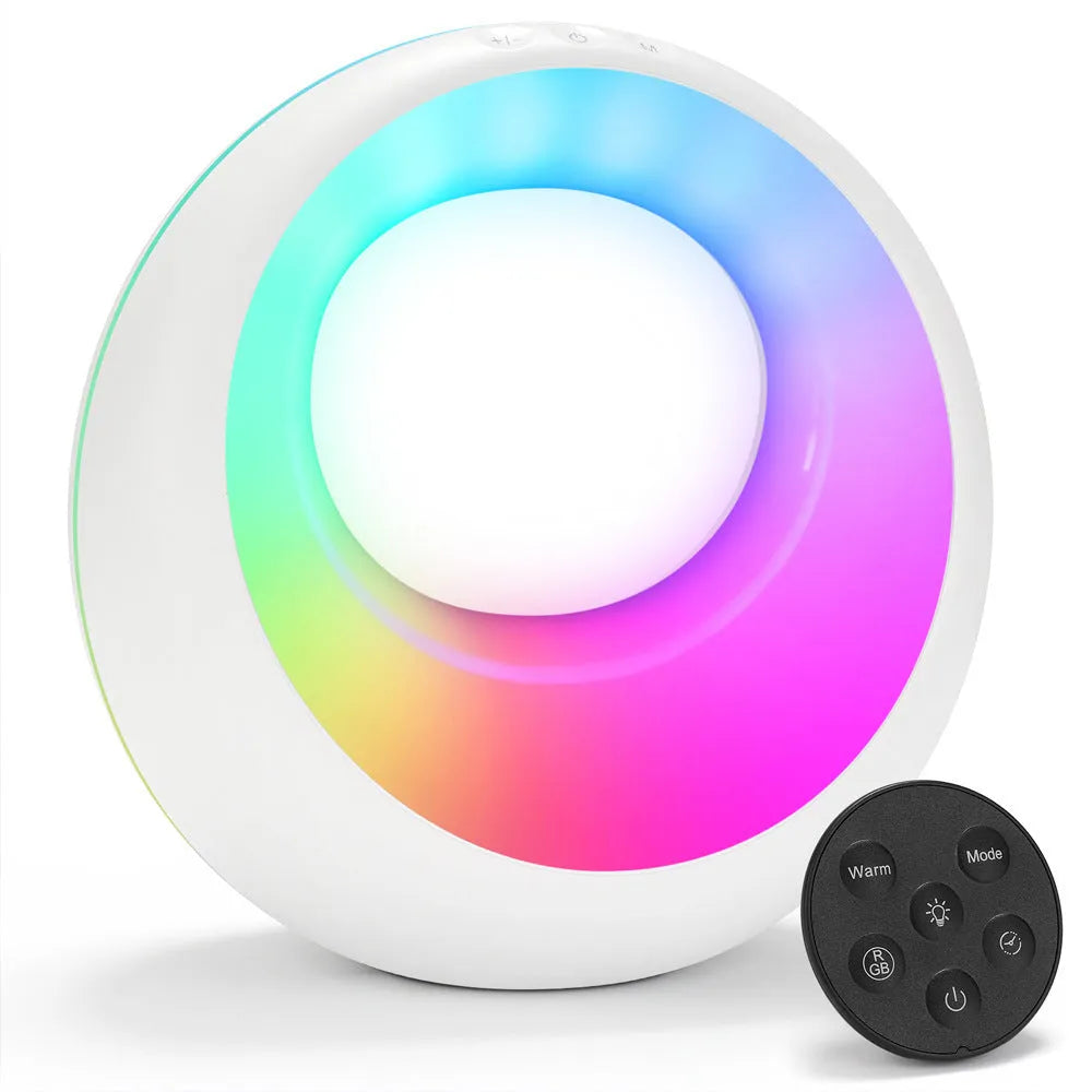Small white RGB colour changing desk lamp with remote control on wooden surface