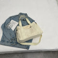Large capacity polyester canvas shoulder bag in solid colour with sandwich pocket