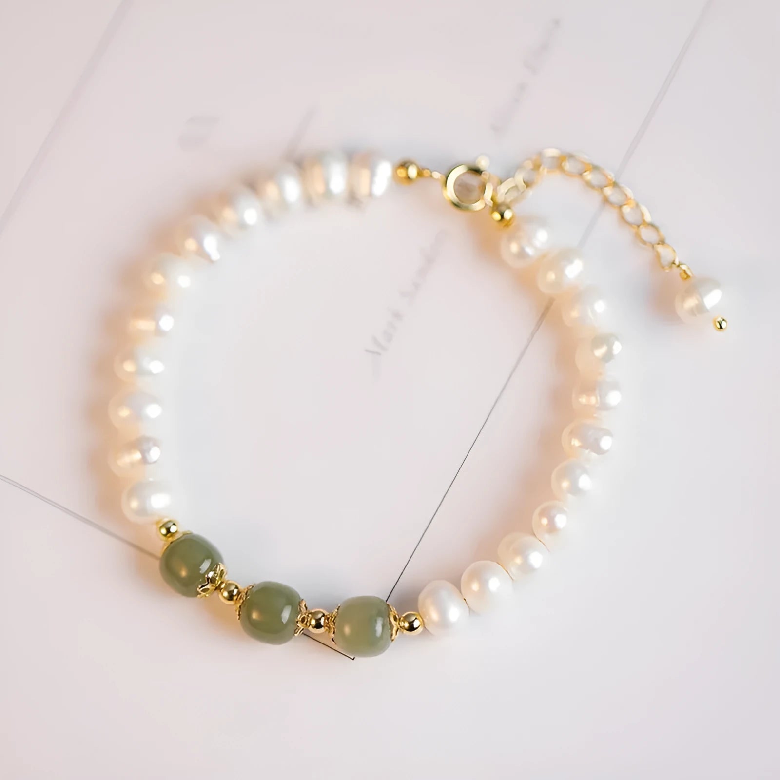 Natural freshwater pearl bracelet with diamond-shaped beads in Korean style, shown in deep Hetian jade colour.