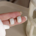Off-white geometric quadrilateral ear studs with dripping oil pearl effect finish for women