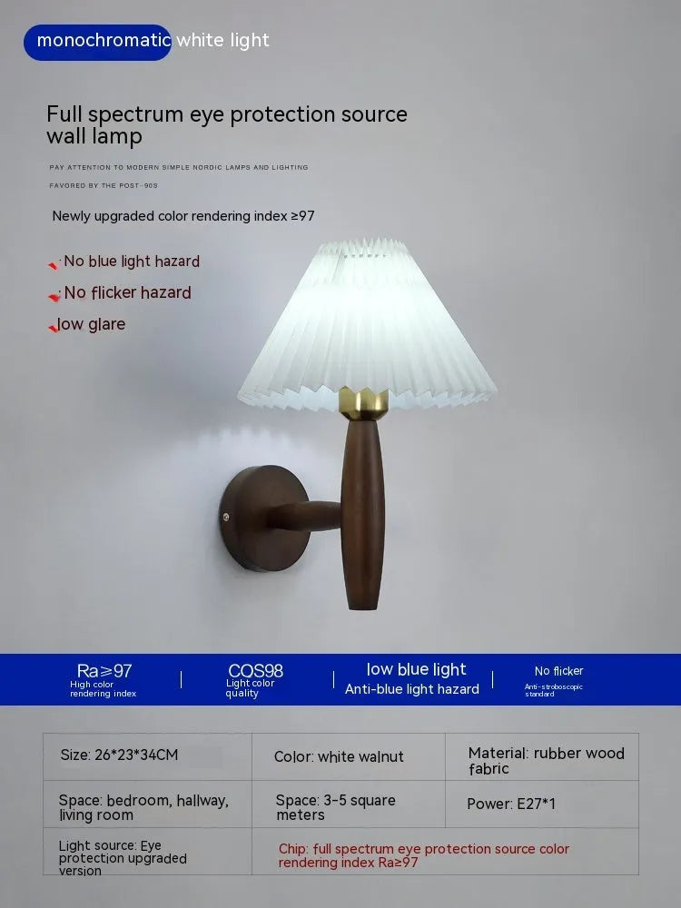 American retro wall lamp with a walnut wood base and white fabric shade mounted on a wall.