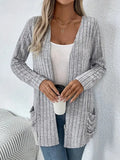 Solid colour long sleeve cardigan with pockets in loose fit, available in grandma grey or black
