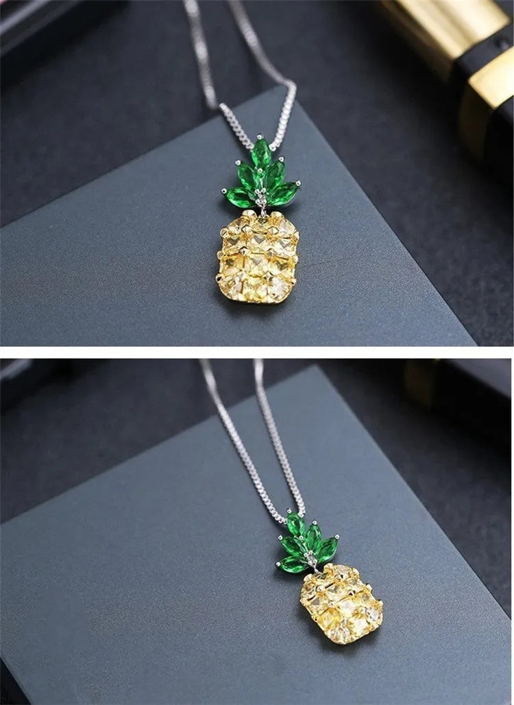 Silver pineapple charm necklace with geometric diamond pattern on adjustable chain