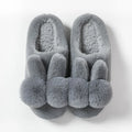 Women's high-top fluffy rabbit fur slippers with floral details in creamy white colour.