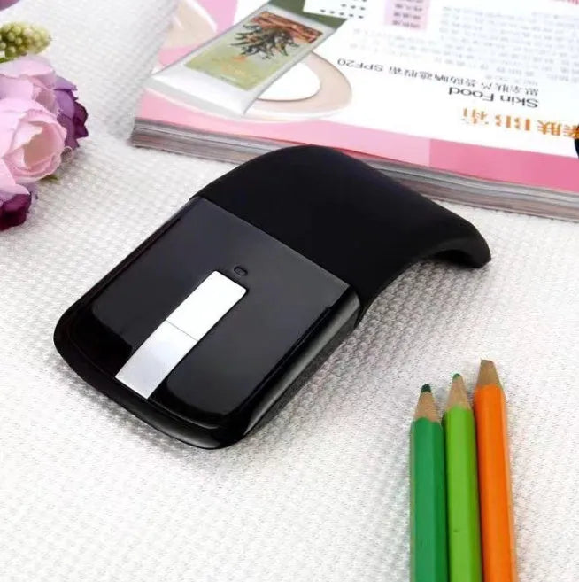 Folding Bluetooth wireless mouse showing compact folded form and unfolded 131.2mm working size