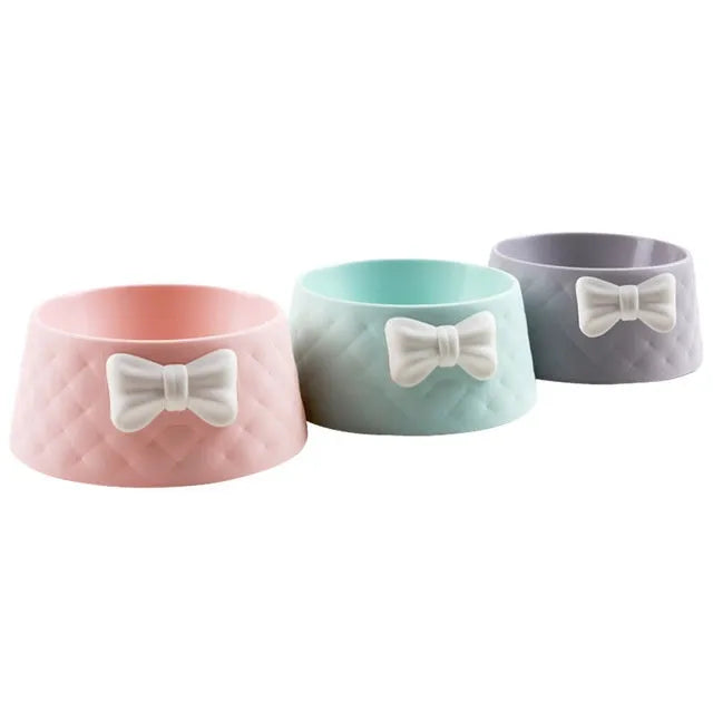 Bow design cat and dog bowl in PP plastic available in pink green and grey colours