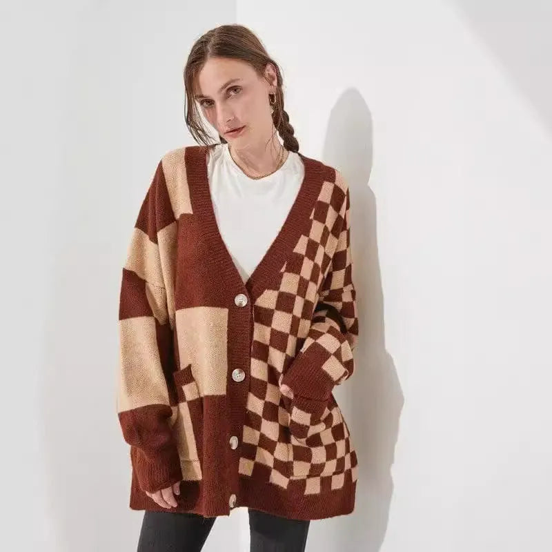 Grey loose fit knitted cardigan with a printed checks pattern, showing regular sleeves and a slim silhouette.