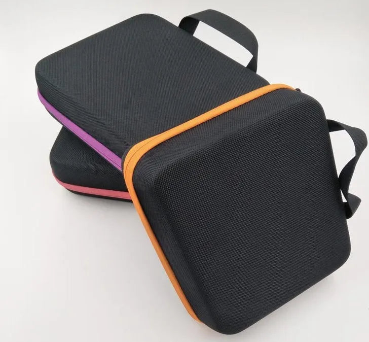 Red cube-shaped essential oil storage bag with 30 compartments for 15ml bottles, shown with zip open.