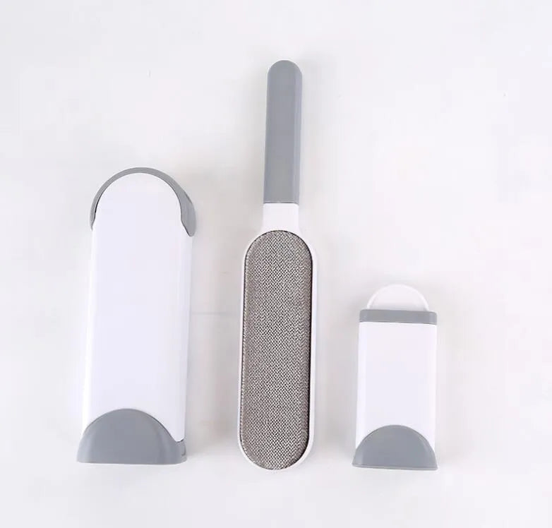 Blue reusable pet hair removal brush with sticky flannel head placed in its self-cleaning base.