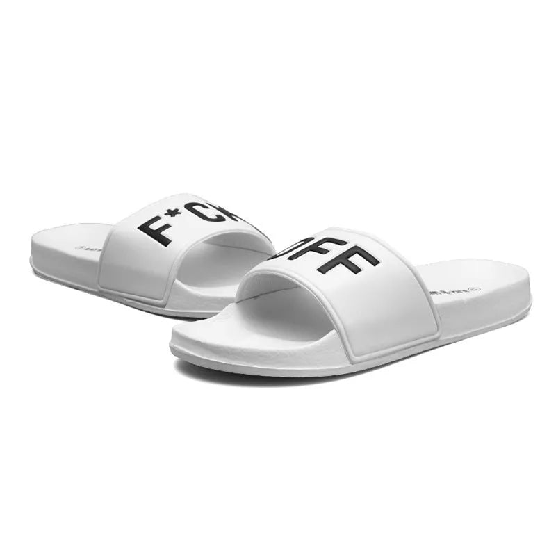 Men's black open-toe slippers with a rubber sole and viscose upper, shown next to a white pair.