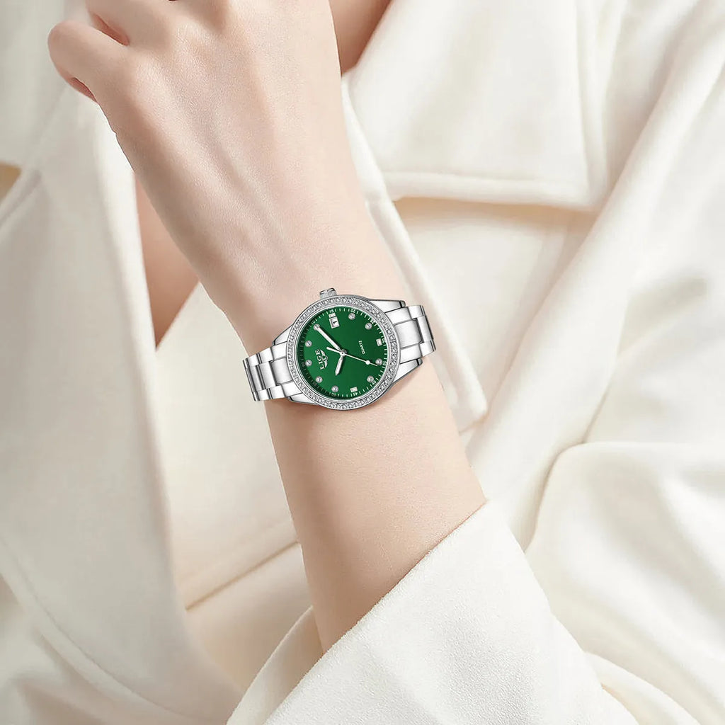 Silver fashion quartz watch with diamond-encrusted round dial and stainless steel case on wrist.