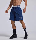 Men's loose black sports cropped shorts with elastic waistband and printed letter detailing