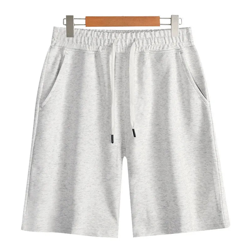 Cotton straight leg sports shorts in light grey colour showing relaxed fit and micro-elastic fabric