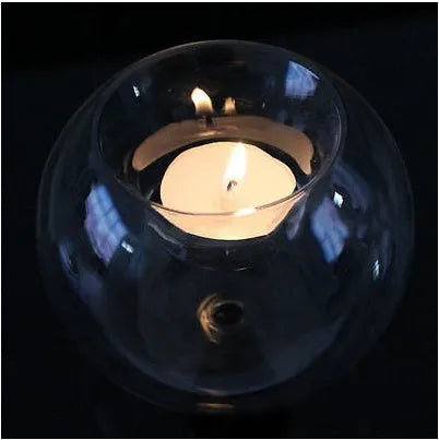 Handmade European style round hollow glass candle holder in three sizes.