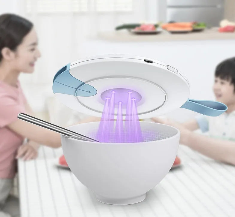 A slim, portable baby bottle sterilizer in blue or pink, showing USB port and compact design.