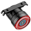 Black aluminium smart brake sensing USB rechargeable bicycle taillight showing compact size.