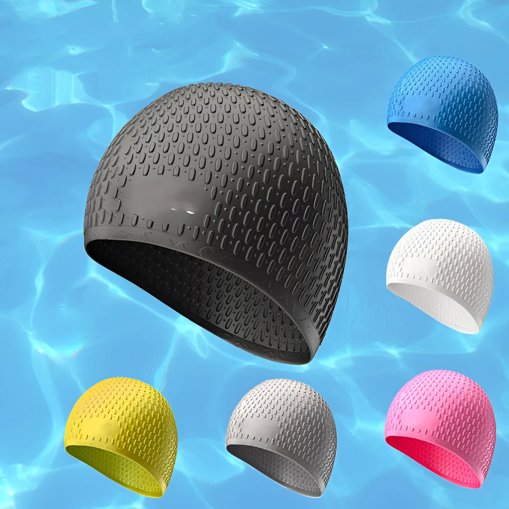 Solid colour silicone swimming cap for adults shown in multiple fashion colours.