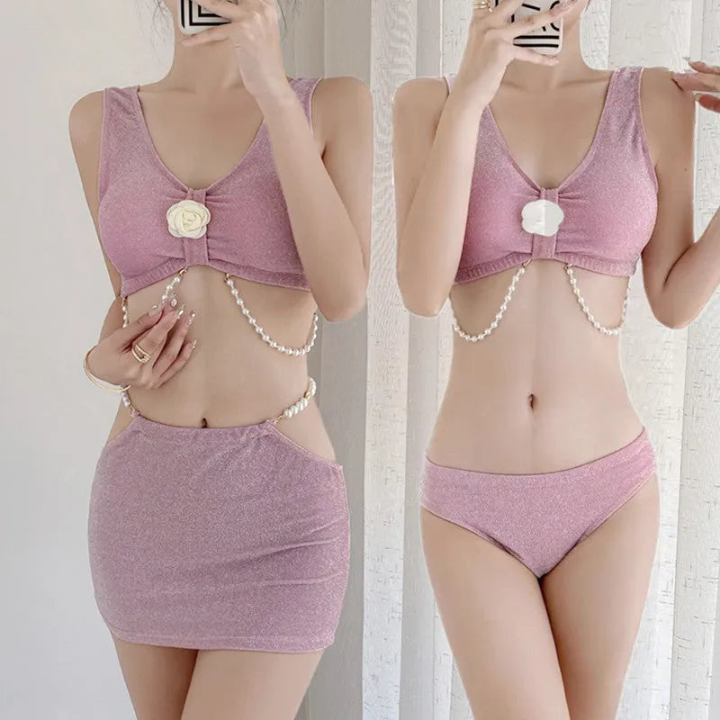 Women's pink and black three-piece polyester bikini set with briefs style and backless design