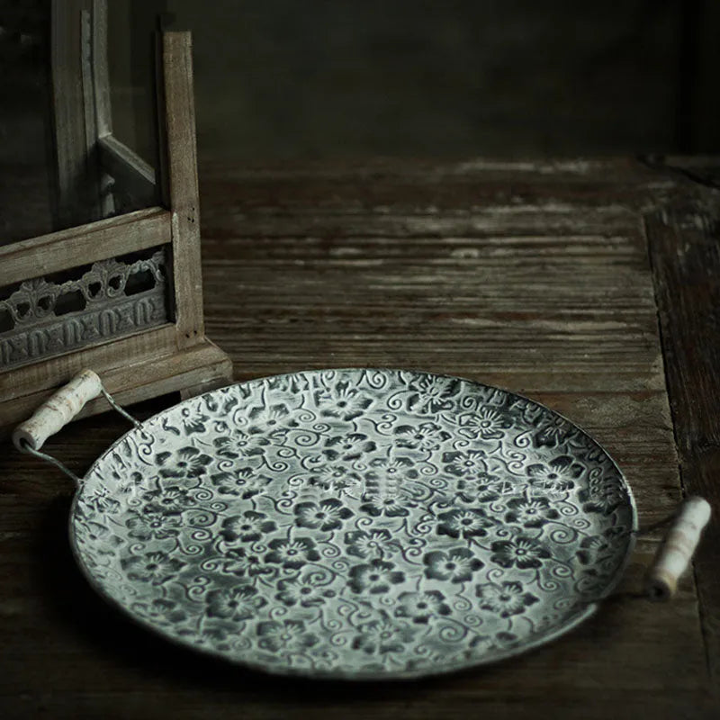 Round wrought iron belt-style storage tray shown in two available sizes.