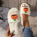 Yellow pumpkin cartoon plush slippers with synthetic fur upper and PVC sole, open toe design.