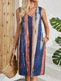 Sleeveless V-neck dress with colour block stripes in mid-length vest style