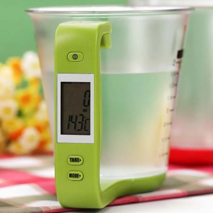 Green electronic kitchen measuring cup scale with LCD display built into handle