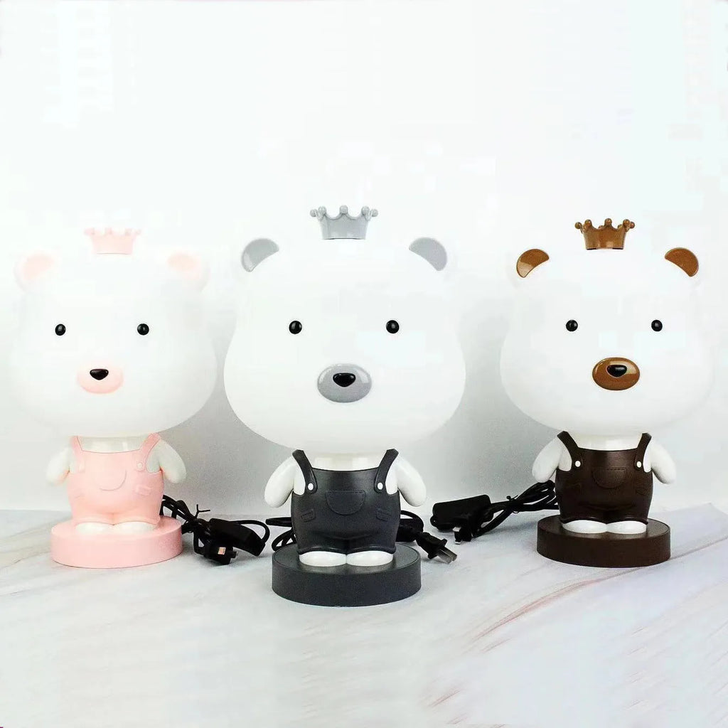 Cartoon-style animal LED table lamp on a table, showing one random design from Bear, Cattle, Rabbit, or Tiger options.