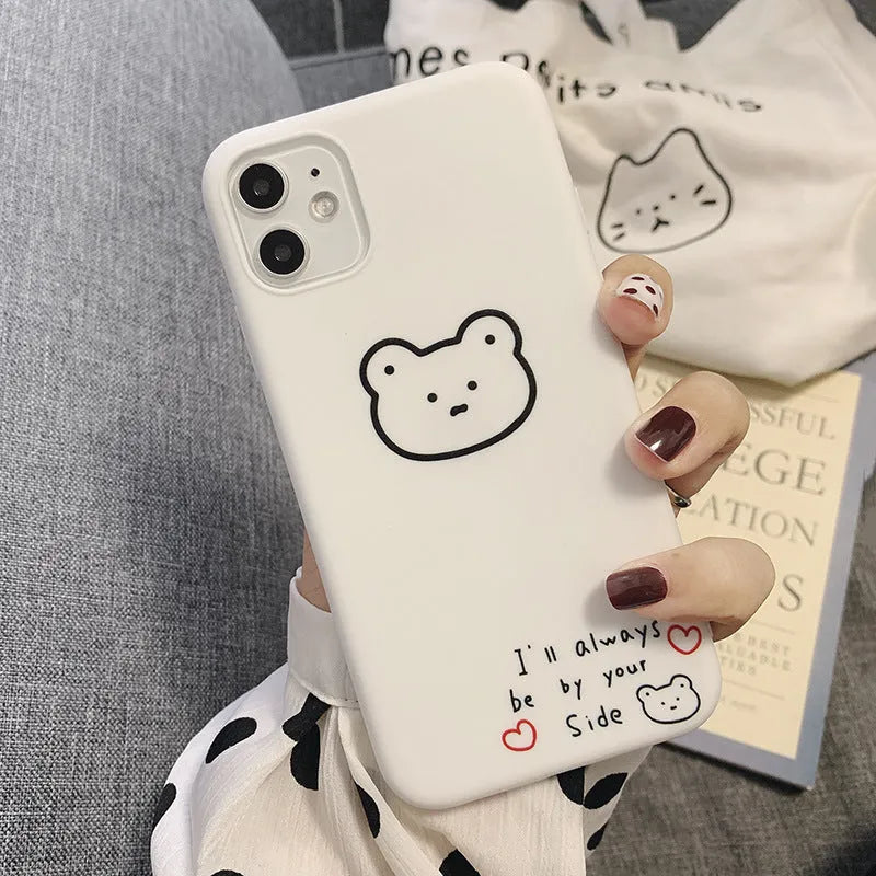 Silicone iPhone back cover case featuring a cartoon Korean bear design, shown on a mobile phone.
