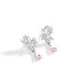 Sterling silver butterfly stud earrings with crystal details on woman's earlobe