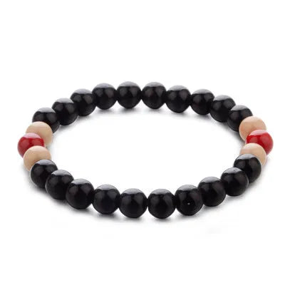 Natural stone bead bracelet with ethnic styling and lava stone components for essential oils