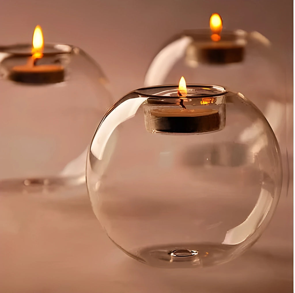 Handmade European style round hollow glass candle holder in three sizes.
