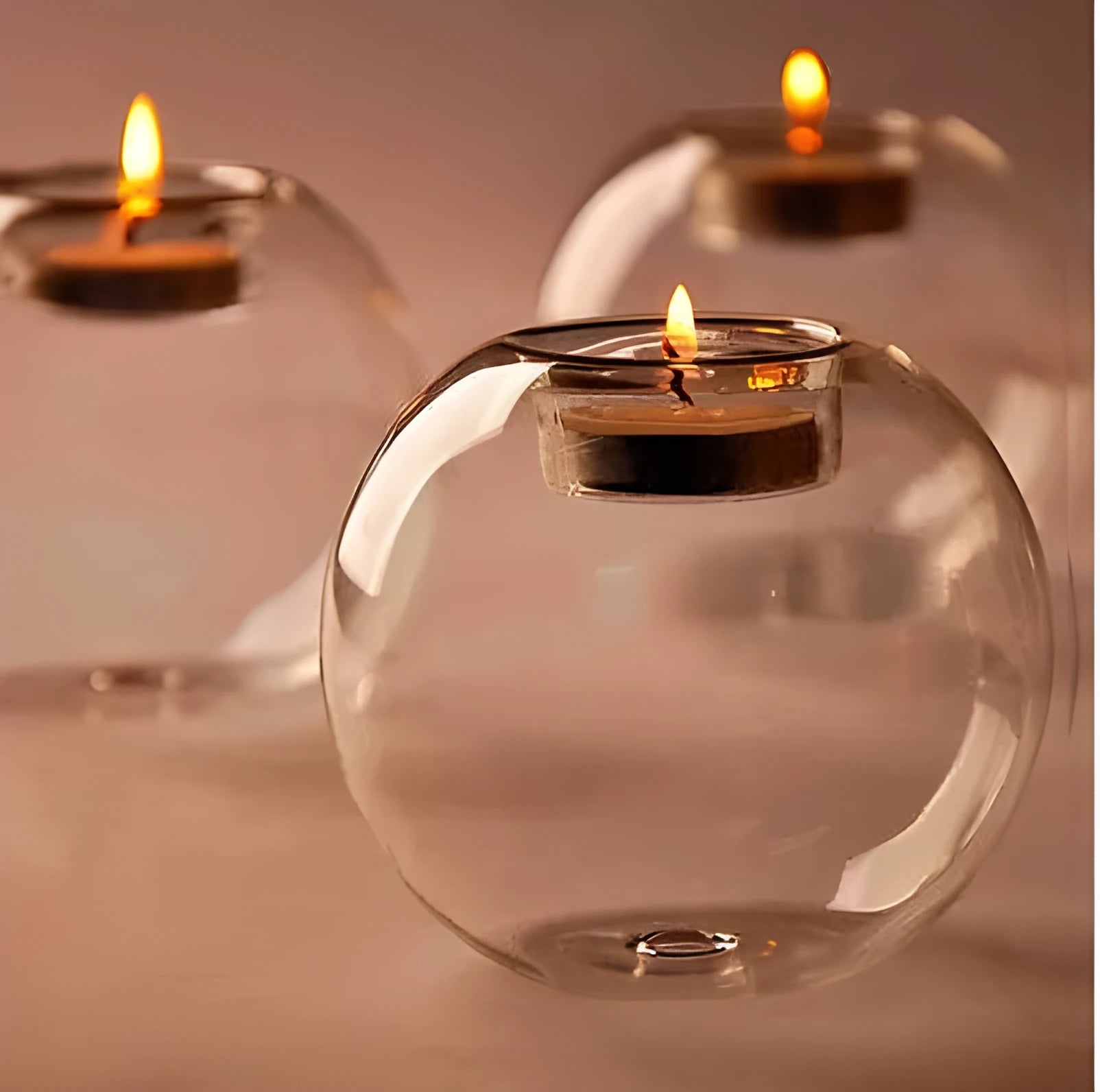 Handmade European style round hollow glass candle holder in three sizes.