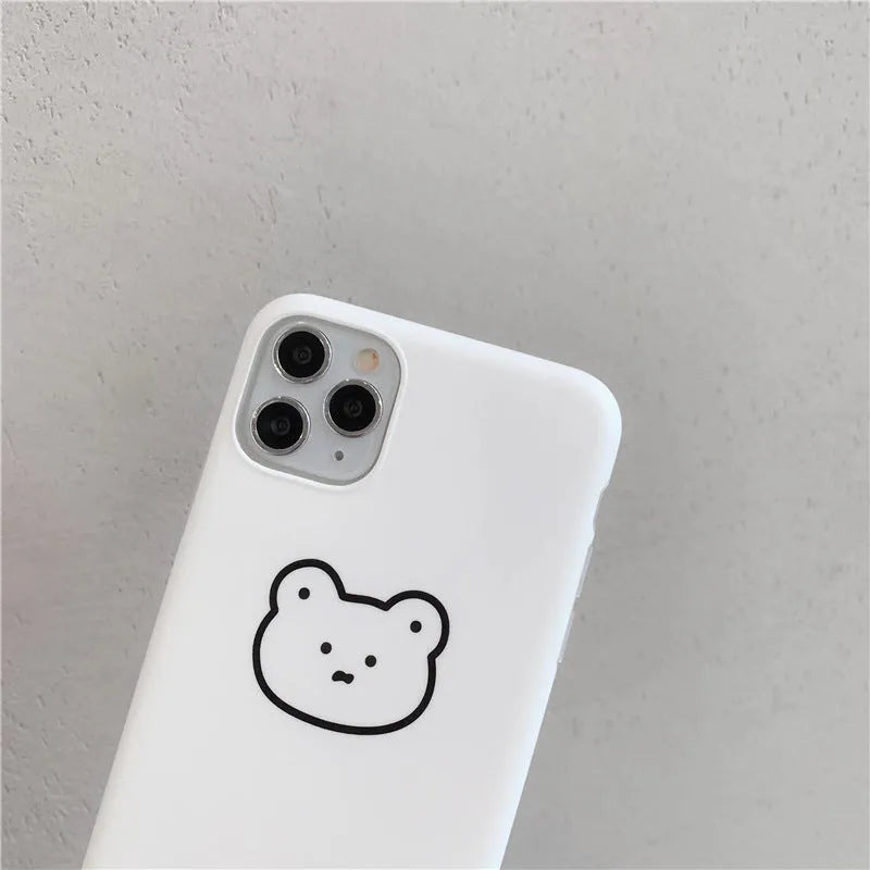 Silicone iPhone back cover case featuring a cartoon Korean bear design, shown on a mobile phone.