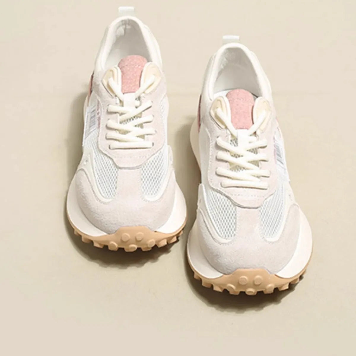Women's grey and pink retro sneakers with low-top design and rubber sole