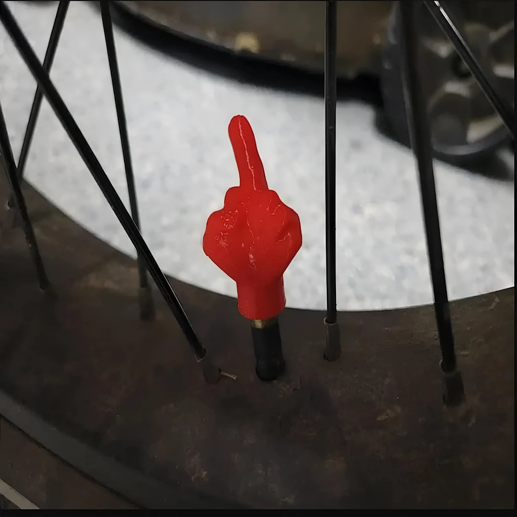 Four latex tyre valve dust caps showing black and skin colour options
