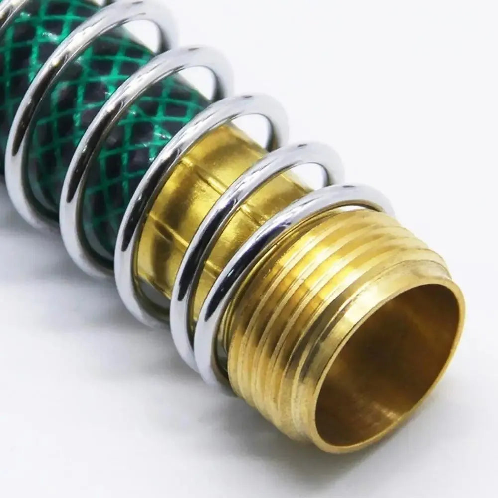 Brass garden hose spring connector with spiral visible inside, shown next to a tape measure indicating 15 cm length.
