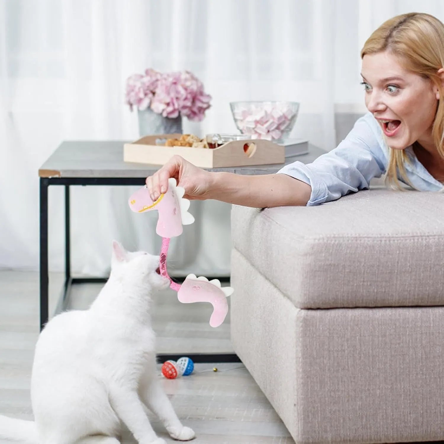 Set of four cat toys including catnip rope, interactive kicker, spring, and plush chew toys in pink, purple, and yellow