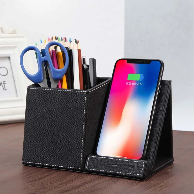Black leather desk organiser with wireless phone charging surface and pen holder compartment