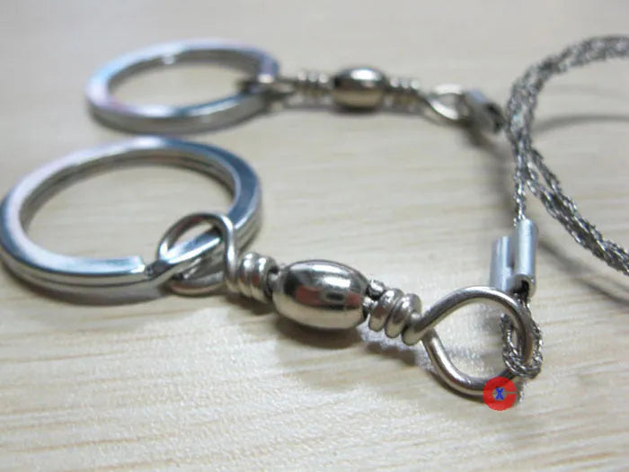 Stainless steel survival wire saw with thumb rings for outdoor cutting