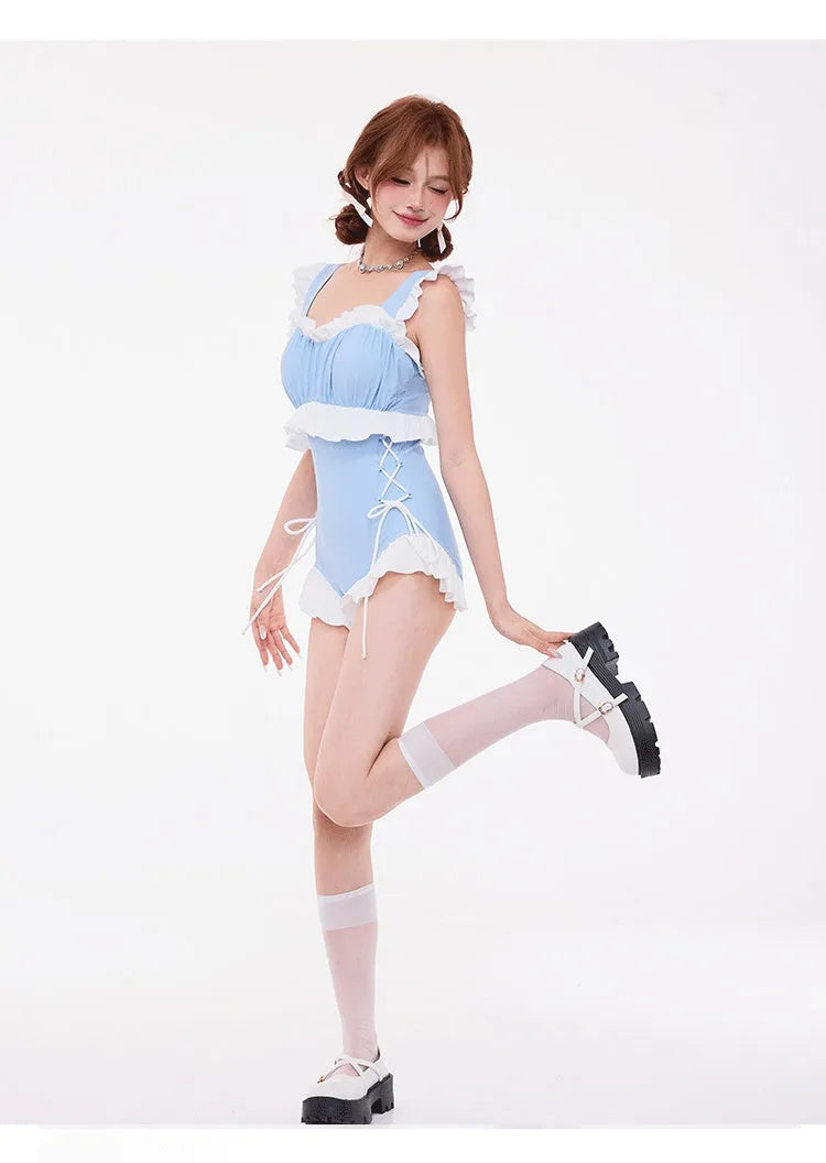 Light blue high-waisted women's swimsuit with lace detailing and backless design