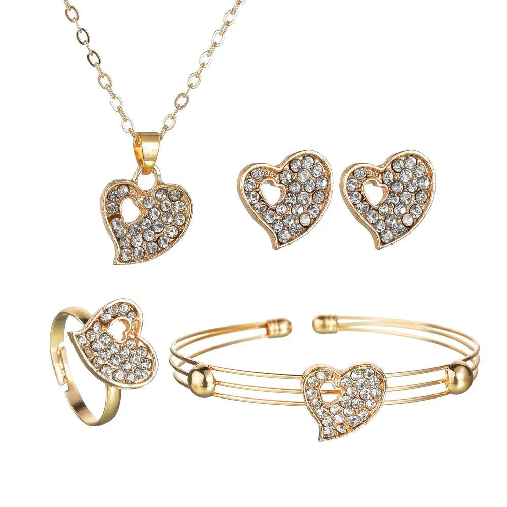Gold alloy jewellery set with love, water drop and bell charms including earrings, pendant and bracelet